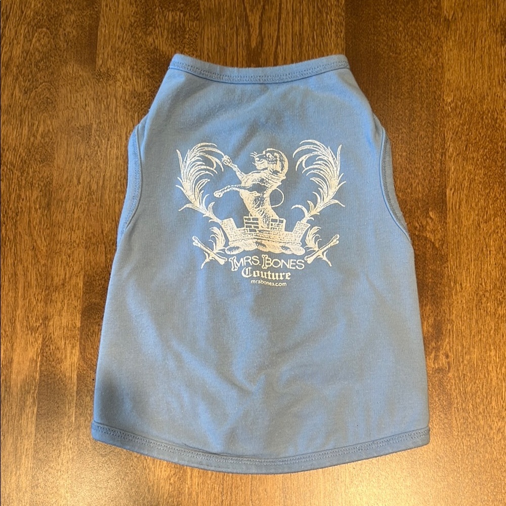 Blue dog shirt with white decal.